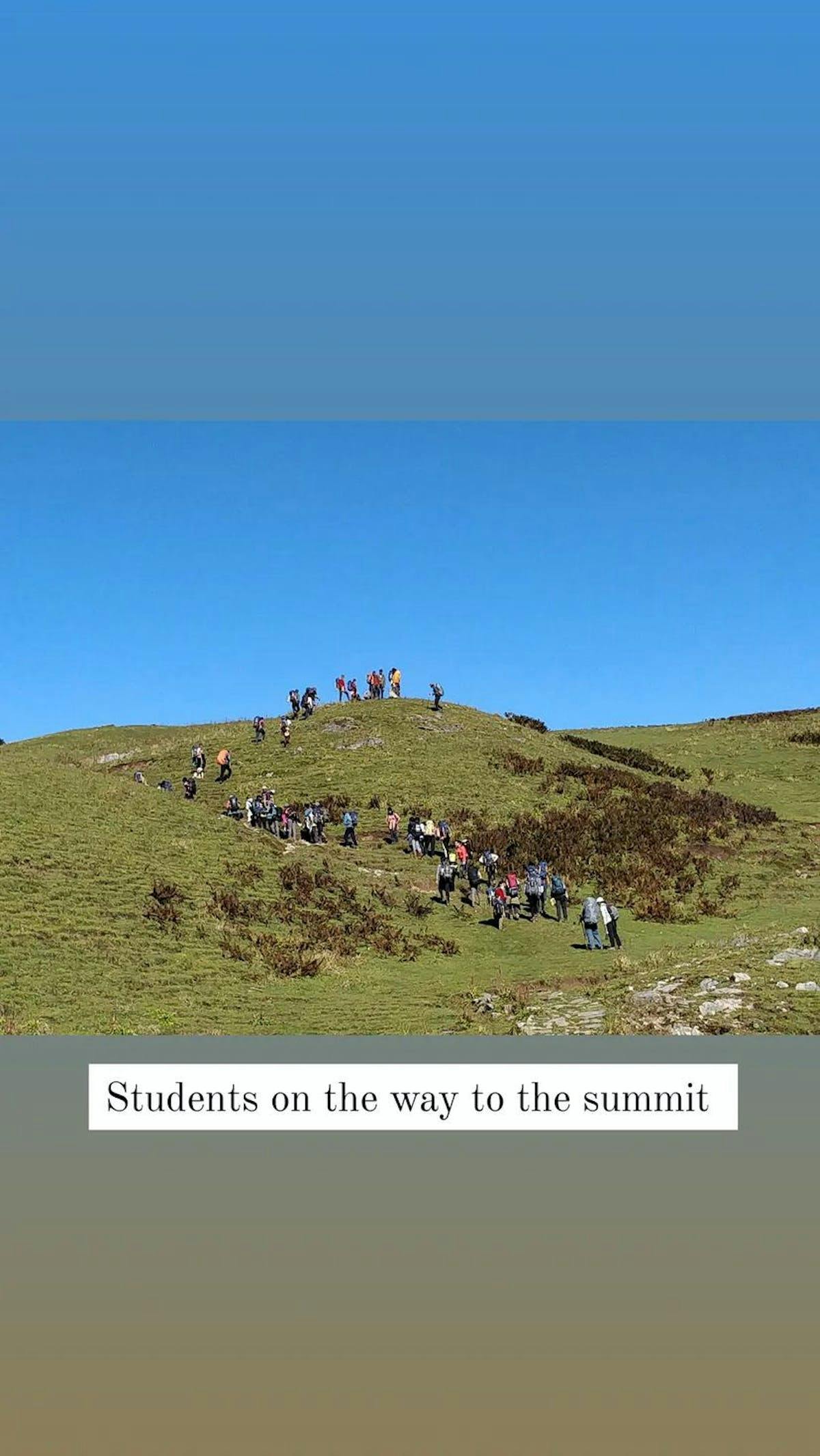 Students eagerly walking to the summit 